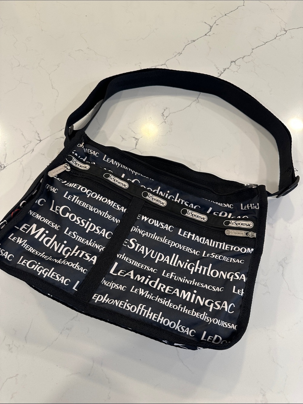 LeSportsac Deluxe Everyday Bag in Black Text-Print Crossbody Messenger Bag